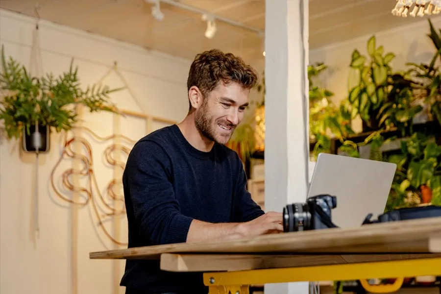 Smiling man browsing a website
